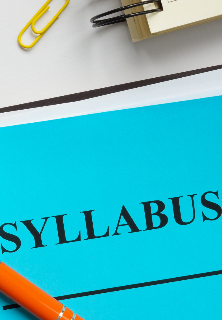 binders and paper labeled syllabus