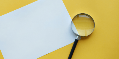 magnifying glass on yellow background